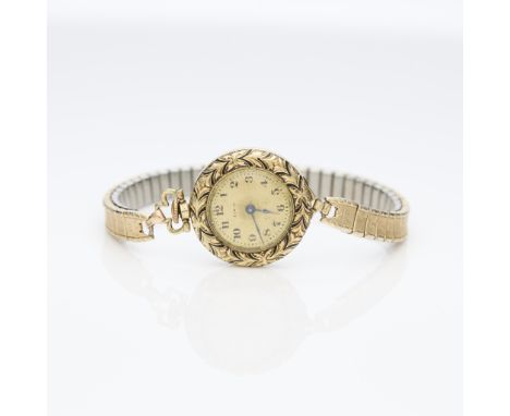 14k yellow gold Lady Elgin pocket watch, modified into a wristwatch. The watch a 14k yellow gold Lady Elgin open face pocket 