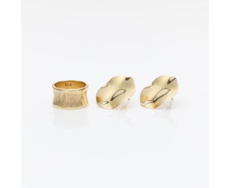 Group of two pieces 14k yellow gold jewelry. Including:One 14k yellow gold textured and flared band ring. Marked 14k and Lohe