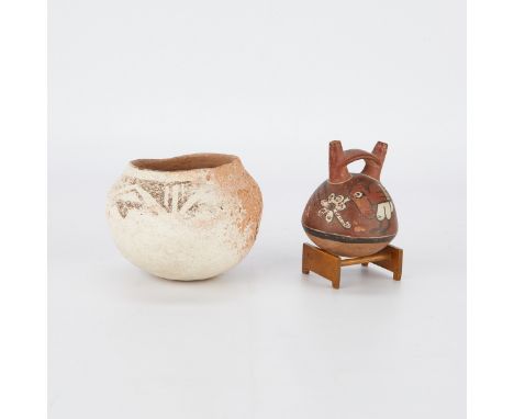 Group of two pueblo pottery vessels including a black-on-white Zuni ceramic pot or bowl depicting a heavily worn triangular g