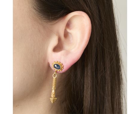 22k yellow gold earrings, each set with an approximately 1 ct bezel set cabochon sapphire in a granulated sunburst halo, susp