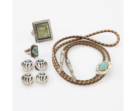 Group of four pieces of Southwest jewelry, including:One Bell Trading Post bolo tie with two tone leather braid, sterling sil