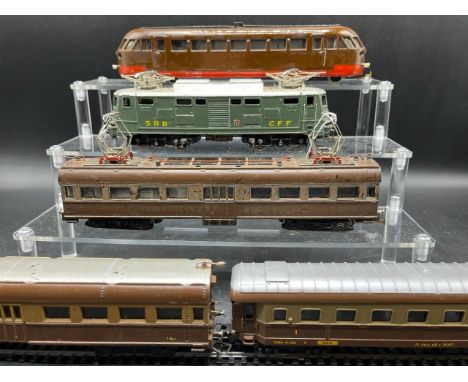 A continental Locomotive, Tram and Railcar each motorised with two Brown/Silver cars/coaches(2500g)Each motorised model is he