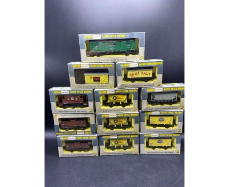 12 '00' gauge 'Ready to Roll' Wrenn Wagons. (1000g)2 x W5022 'Fyffes'1 x W4311P 'LMS'1 x W4625 Grain Wagon2 x W4630 Cattle Wa