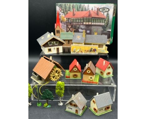A selection of HO Faller, Vollmer and other plastic scenic buildings, with Preiser 1:90 scale figures as shown(900g)Some of t