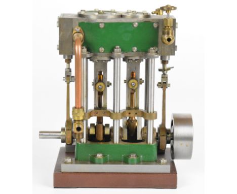 Stuart compound launch live steam engine with displacement lubricator, driving a solid flywheel, mounted on a wooden base, le