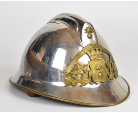 French Adrian pattern chrome plated fireman's helmet with brass 'Sapeurs Pompiers Nantes' plaque and leather liner