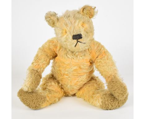 Vintage Teddy bear with golden mohair, disc jointed limbs, humped back, stitched features and squeaker (inoperative), height 