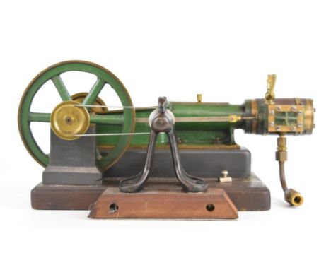 Victorian or early 20th century single cylinder live steam engine with spoked flywheel, with belt drive to attached shaft, ov