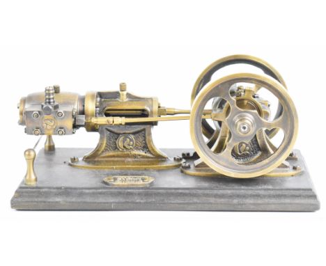 Polish made single cylinder live steam engine with twin spoked flywheels, on wooden base with guard rail, overall length 29cm