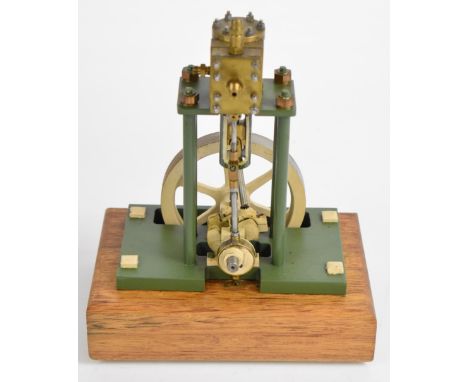 Vertical single cylinder live steam engine with spoked flywheel, on wooden base, height 23cm