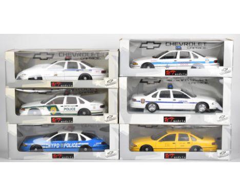 Six UT Models 1:18 scale diecast American police cars and a taxi, all in original boxes.