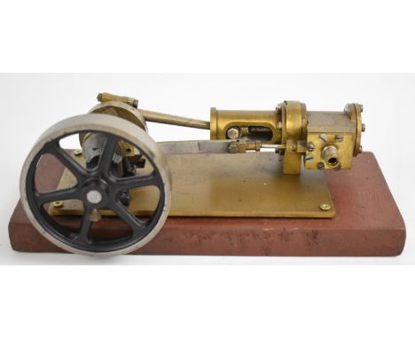 Horizontal single cylinder live steam engine with spoked flywheel, on wooden base, overall length 21.5cm