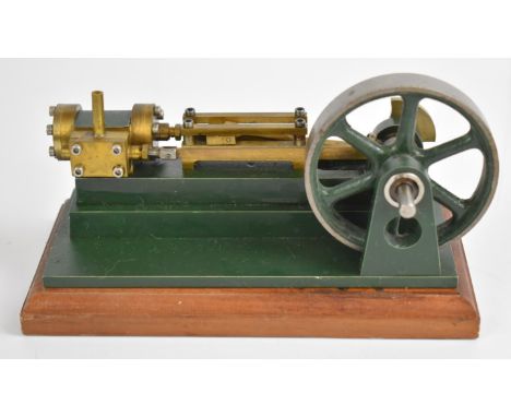 Horizontal single cylinder live steam engine in the style of a small Stuart S50 with spoked flywheel, on wooden base, overall