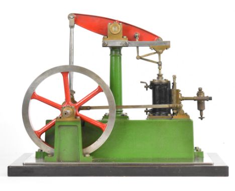 Stuart Beam live steam engine with displacement lubricator, twin cylinder drain cocks, driving a spoked flywheel, on a Tufnol