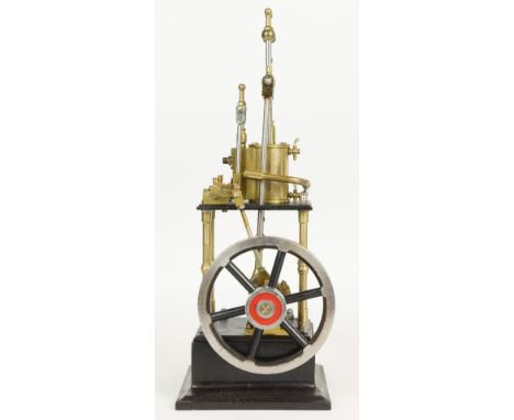 James Coombes type single cylinder live steam engine with spoked flywheel and cylinder drain cocks, on black painted base, he