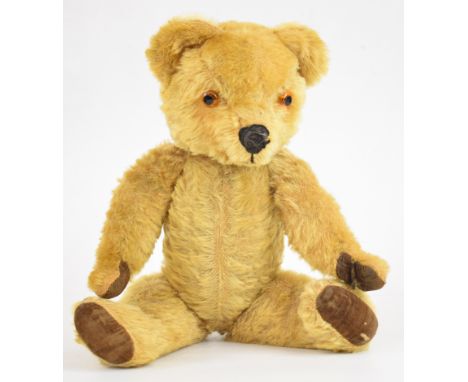 Vintage Teddy bear with golden mohair, disc jointed limbs, felt pads, stitched features and growler, height 43cm.