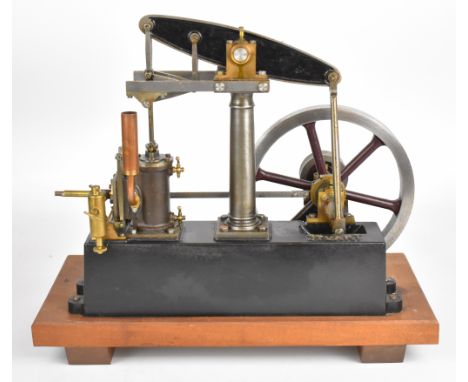 Stuart Beam live steam engine with displacement lubricator and twin cylinder drain cocks, driving a spoked flywheel, on woode