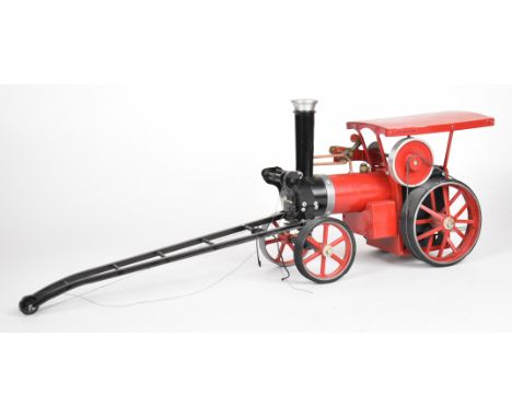 Mamod live steam crane engine with red wheels, boiler and canopy
