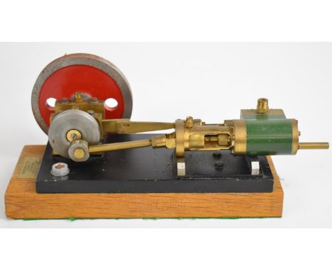 H.C.Crutchley, Suffolk, horizontal single cylinder live steam engine with disc flywheel, on wooden base, with sticker giving 