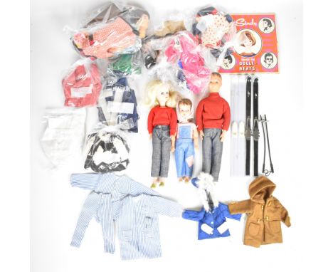 Three vintage Sindy dolls by Pedigree comprising Sindy, Patch and Paul, together with a collection of original clothing and a