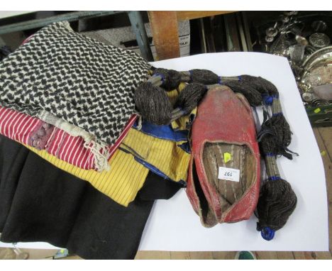 A collection of Middle Eastern style vintage clothing, to include robes, one black with wire work decoration, the other in ye