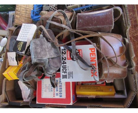 A collection of vintage cameras and accessories