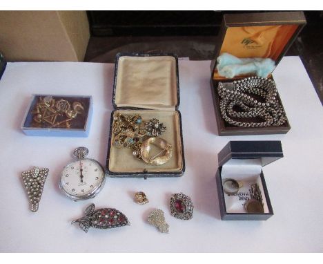 A collection of vintage costume jewellery, to include necklace, brooches, earrings, clips etc and a stop watch