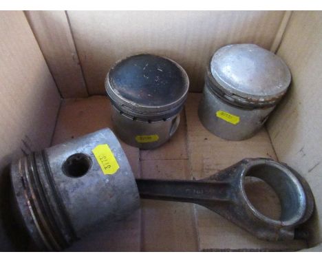 Three Aston Martin piston heads, together with a con rod