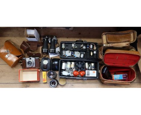 A box of vintage cameras, binoculars to include Paxina camera, Pulsar watch, Regent binculars, Will Wetzler lenses