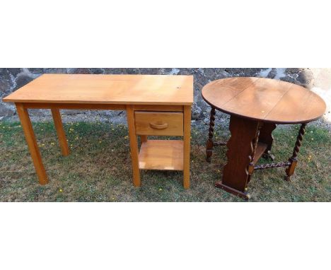 An oak desk, fitted with a drawer, over a shelf, 48ins x 22ins x height 29.5ins, together with an oak drop leaf table with ba