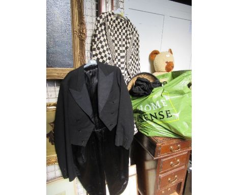 A collection of vintage clothing, to include two tail coats, one in black and white cheque, a pair of wooden clogs, Japanese 