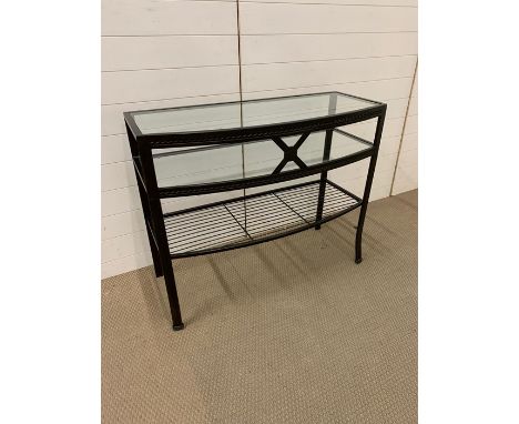 A glass and metal console table 