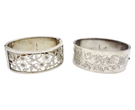 Victorian silver hinged bangle, with pierced floral decoration Birmingham 1880 and one other with engraved floral decoration 