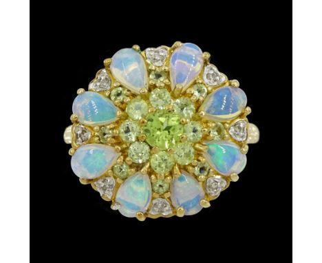 9ct gold pear cut opal and round cut peridot cluster ring, hallmarkedCondition Report:Approx 3.25gm, size N, head = 15.7mm x 