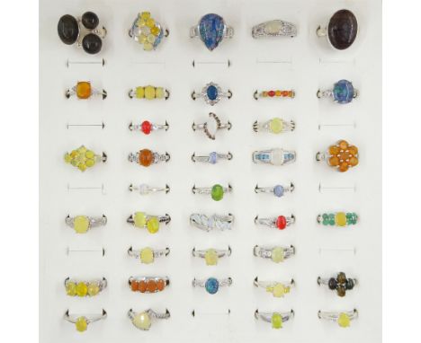 Thirty-eight silver opal  rings including fire opal, triplet, Australian and Ethiopian, some set with other gemstonesConditio