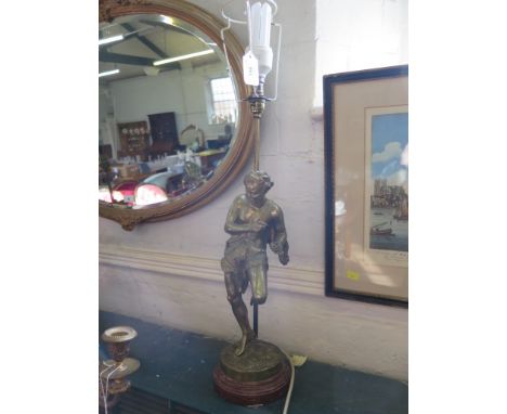 A brass figural table lamp, depicting a man in lion skin, on a rosso marble base, 51 cm high 