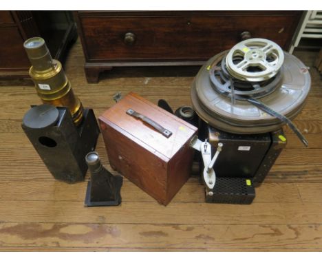 A blacked metal and brass magic lantern, various 16mm film, film cans and other movie related accessories 