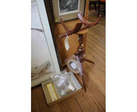 A collection of bone and turned wood lace bobbins, some with glass beads, a lace pillow stand and a print of Honiton lace mak