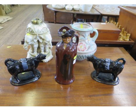 A Bohemian Turn-Teplitz oil lamp base, with elephant supports, 23.5 cm high, an H.J. Wood Ltd vase, a Royal Doulton treacle g