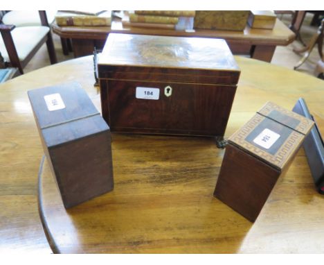 An early 19th century line inlaid tea caddy, of rectangular form with two compartments and gilt metal feet, 25 cm wide, and t