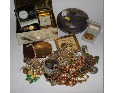 A collection of costume jewellery together with ladies Accurist watch, a ladies compact, an alarm clock, etc 