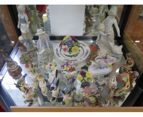 Three Goebel figures of birds: Wood Warbler, Blue Tit, and White Wagtail, other figurines, including a Nao figure of a girl w