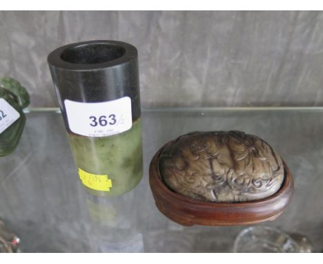 A Chinese mounted jade paperweight, depicting two elders, 9 cm wide, and a Chinese two tone jade cylindrical brush pot, 9 cm 