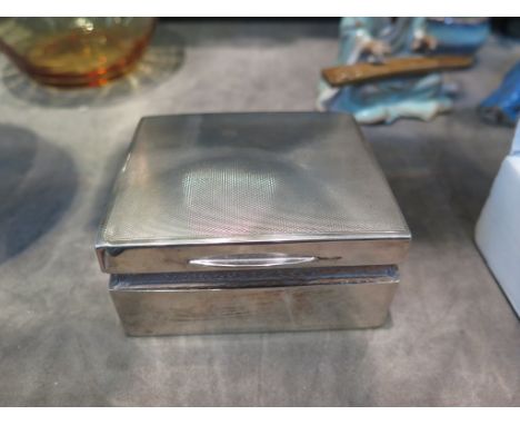 A square silver cigarette box, with engine turned lid, London 1963, 8.5 cm wide 