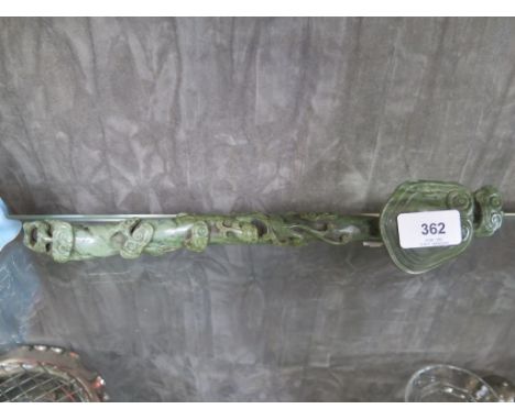A Chinese jade Ruyi Scepter, engraved with foliate scrolls, 31 cm long 