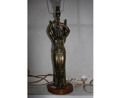 A late Victorian gilt metal table lamp, in the form of an angel holding aloft the light, on a timber base, 47 cm high 