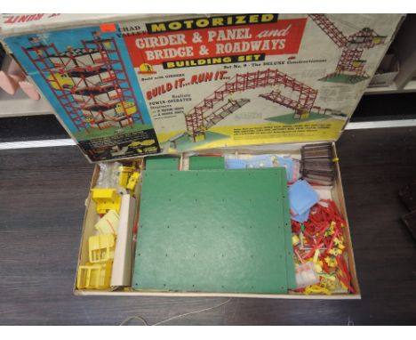 A Chad Valley motorized girder & panel and bridge & roadways part set in original box