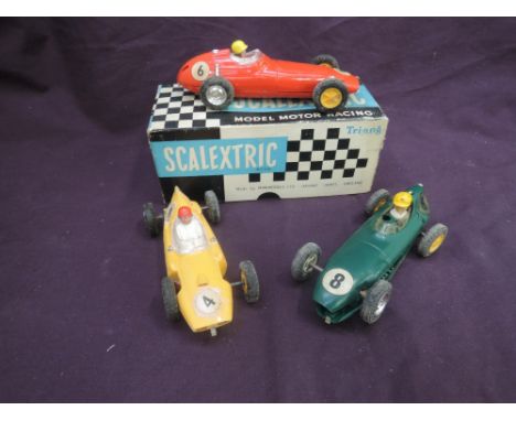 A selection of vintage Scalextric including three racing cars, BRM in red,  boxed C59, Cooper in yellow & similar car in gree