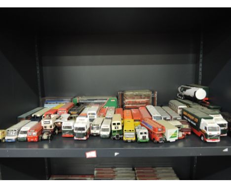 A shelf of mixed diecasts including Dinky & Corgi etc