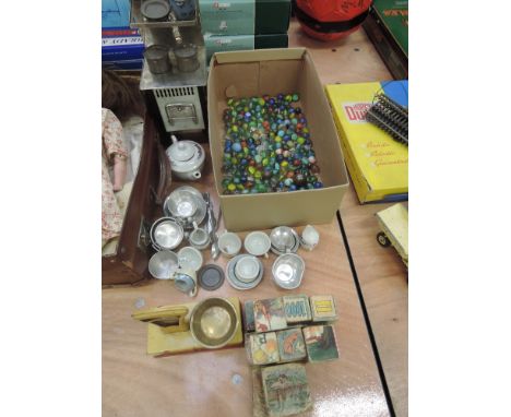 A selection of mixed toys including vintage marbles, tin plate shop weighing scale and cooker, childrens tea wares etc